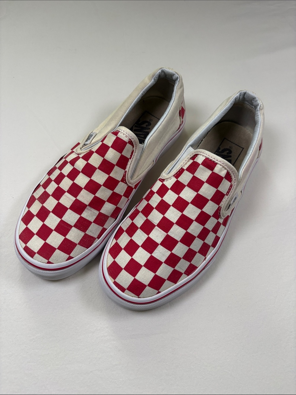 Vans Red and White Checkerboard Slip-On Sneakers